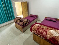 Twin shared room at Adi Yogpeeth yoga school in Rishikesh